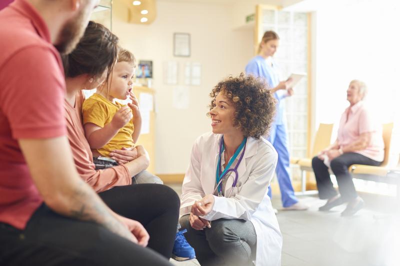 Doctor with Child and Family