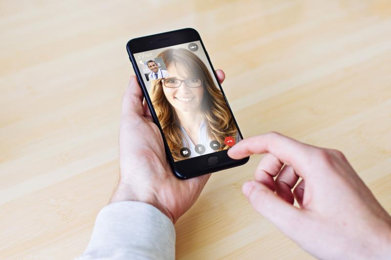 Doctor caring for his patient through our video visit app.