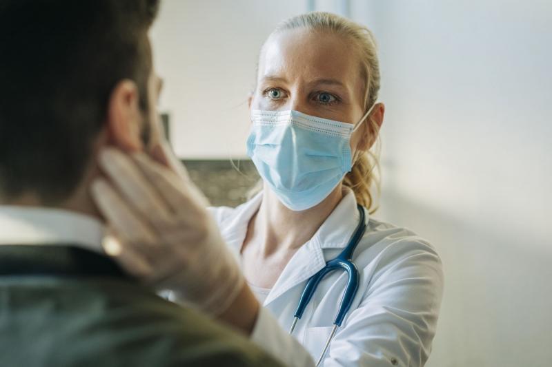 Female physician with patient