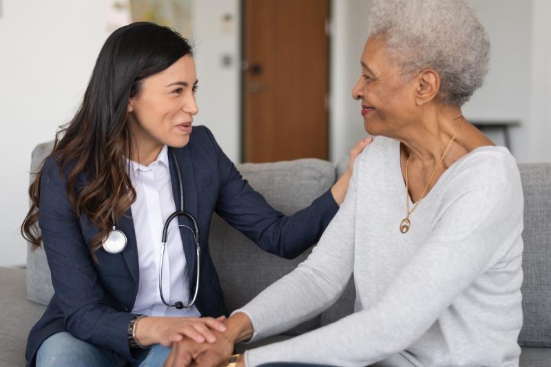 A woman talk with her doctor about what to expect following her visit.