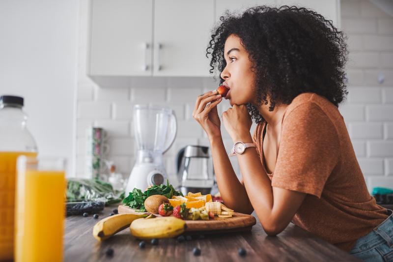 A woman eating healthy.