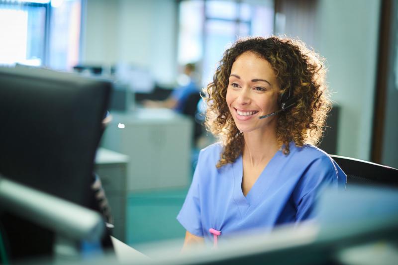 Nurse on phone call at computer