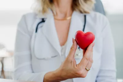 Doctor holding a red heart