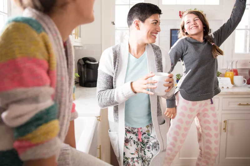 Three women's generations having fun in the kitchen