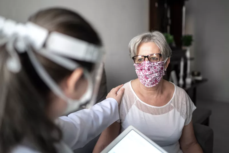 A woman visiting her doctor.